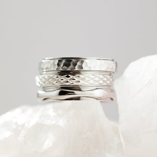 silver spinning cross pattern ring