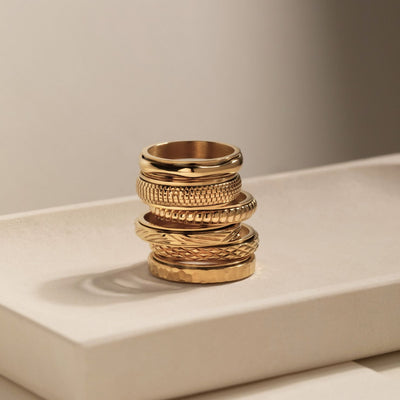 gold spinning cross pattern ring
