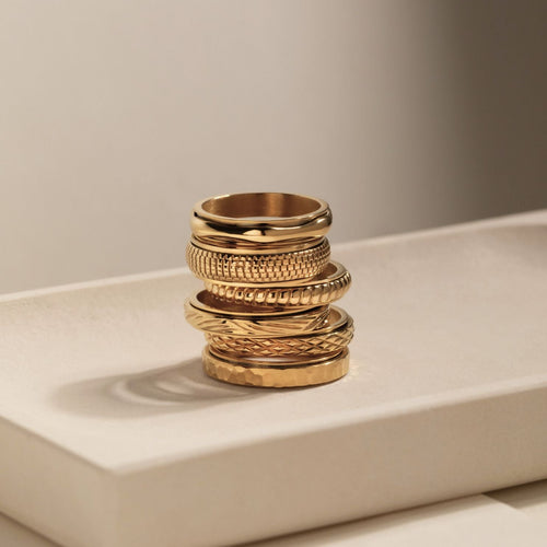 gold spinning cross pattern ring